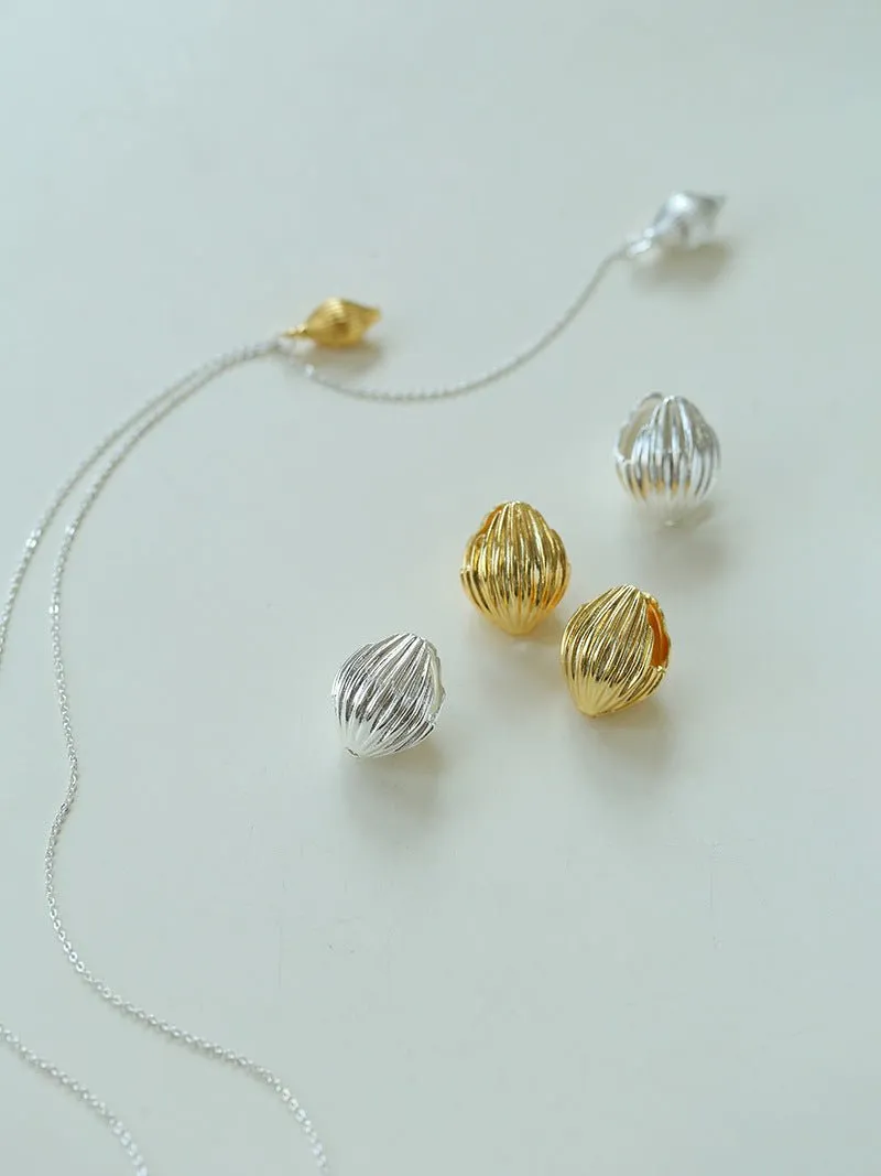 Long Gold and Silver Textured Seed Pendant Necklace